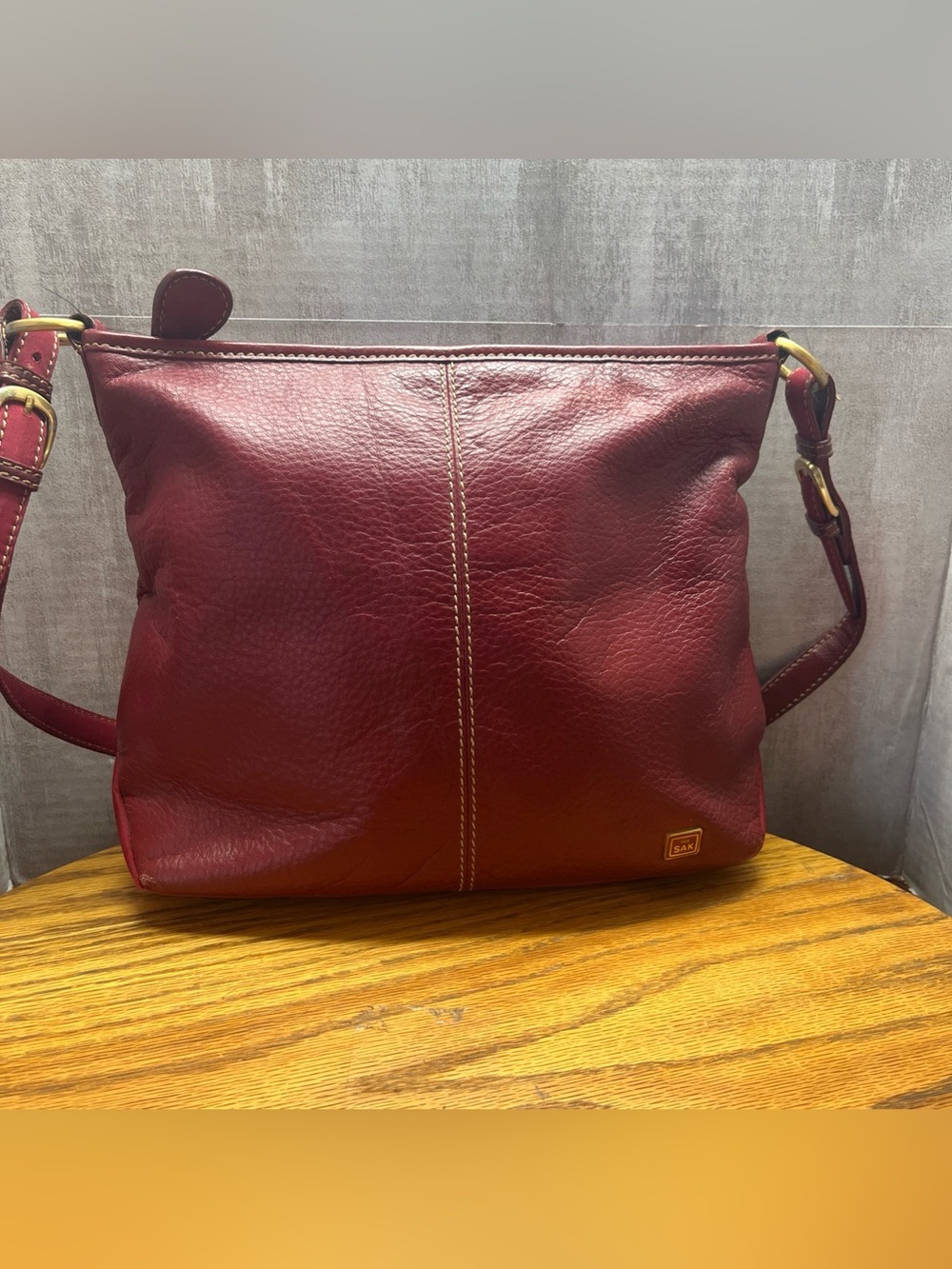 The SAK pebbled, red leather shoulder bag